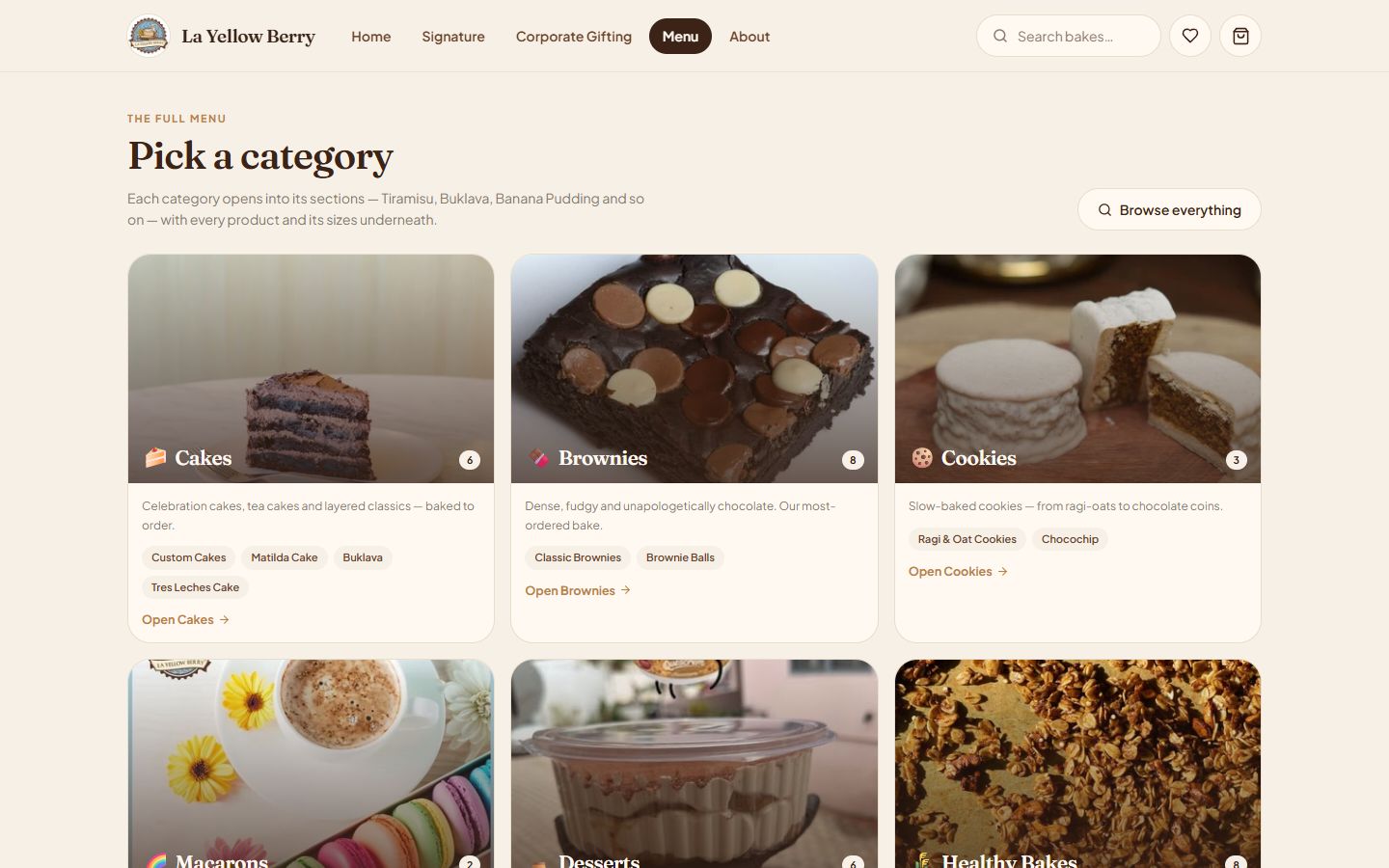 La Yellow Berry online menu for a bakery on Shopify — 'Pick a category' screen with Cakes, Brownies and Cookies cards, item counts and section chips such as Custom Cakes, Matilda Cake and Ragi & Oat Cookies